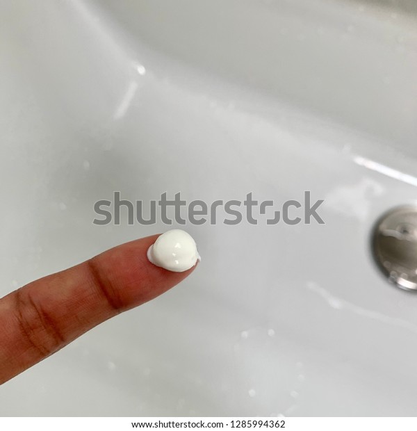 applying-face-cream-pea-sized-600w-1285994362.jpg