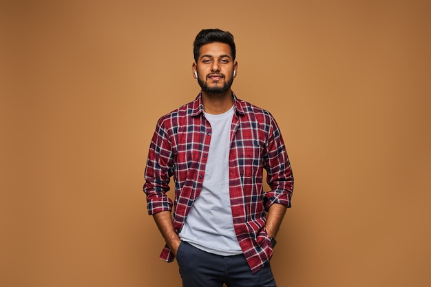 stylish-handsome-indian-man-tshirt-pastel-wall_496169-1571.jpg