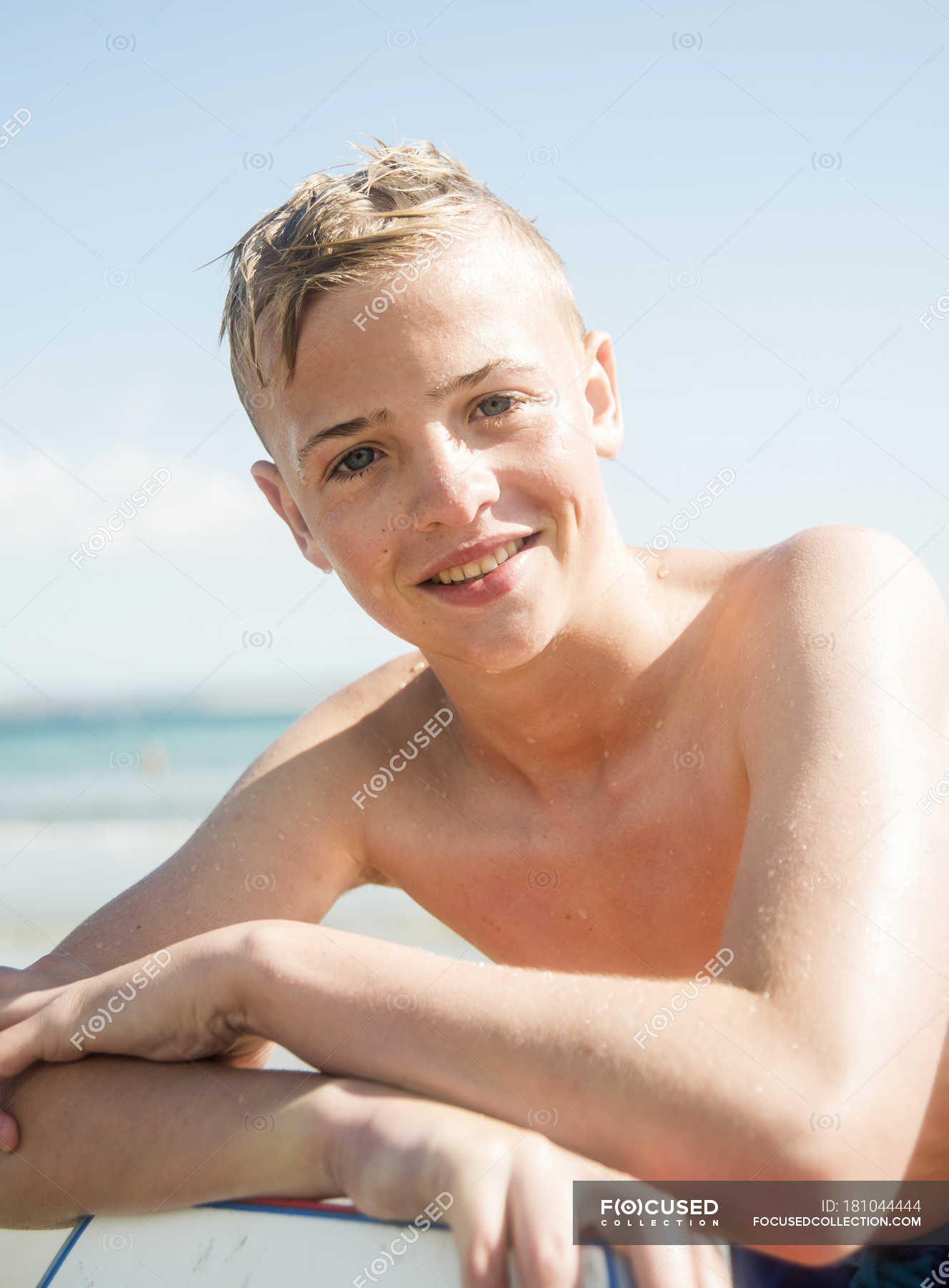 focused_181044444-stock-photo-portrait-smiling-teenage-boy-beach.jpg