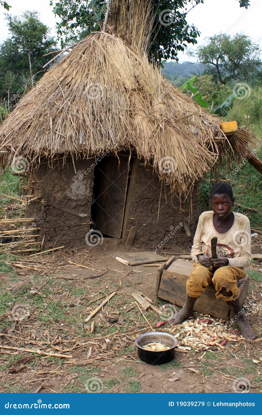 african-boy-mud-hut-19039279.jpg