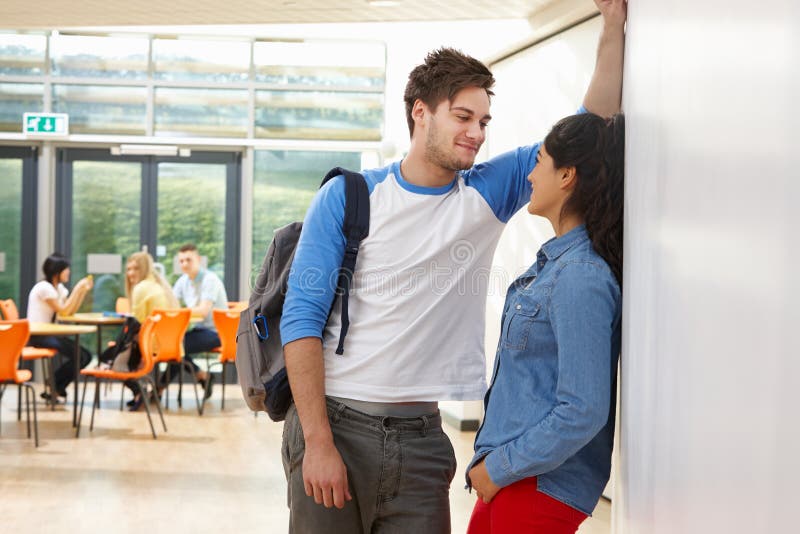 teenage-couple-talking-school-classroom-wall-37720743.jpg