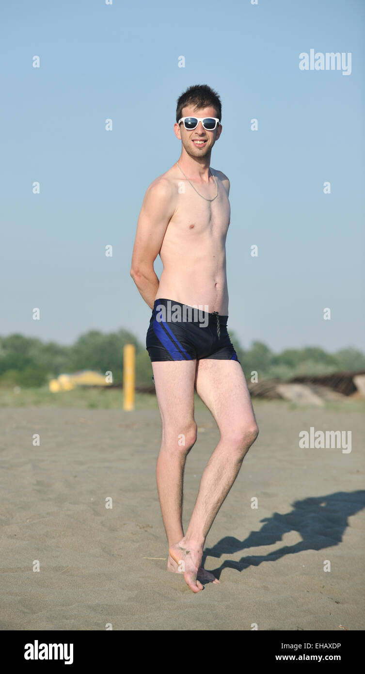 man-relax-on-beach-EHAXDP.jpg