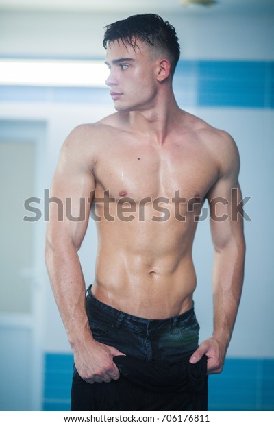 man-naked-wet-athletic-body-600w-706176811.jpg