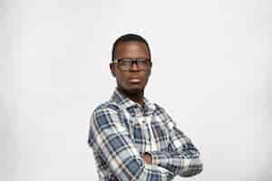 arrogant-afro-american-young-hipster-wearing-glasses-black-frame-checkered-shirt-looking-with-indifferent-stony-facial-expression-keeping-his-arms-folded_273609-206.jpg