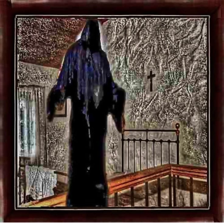 This may contain: a painting of a person in a black robe and cross on the wall behind them