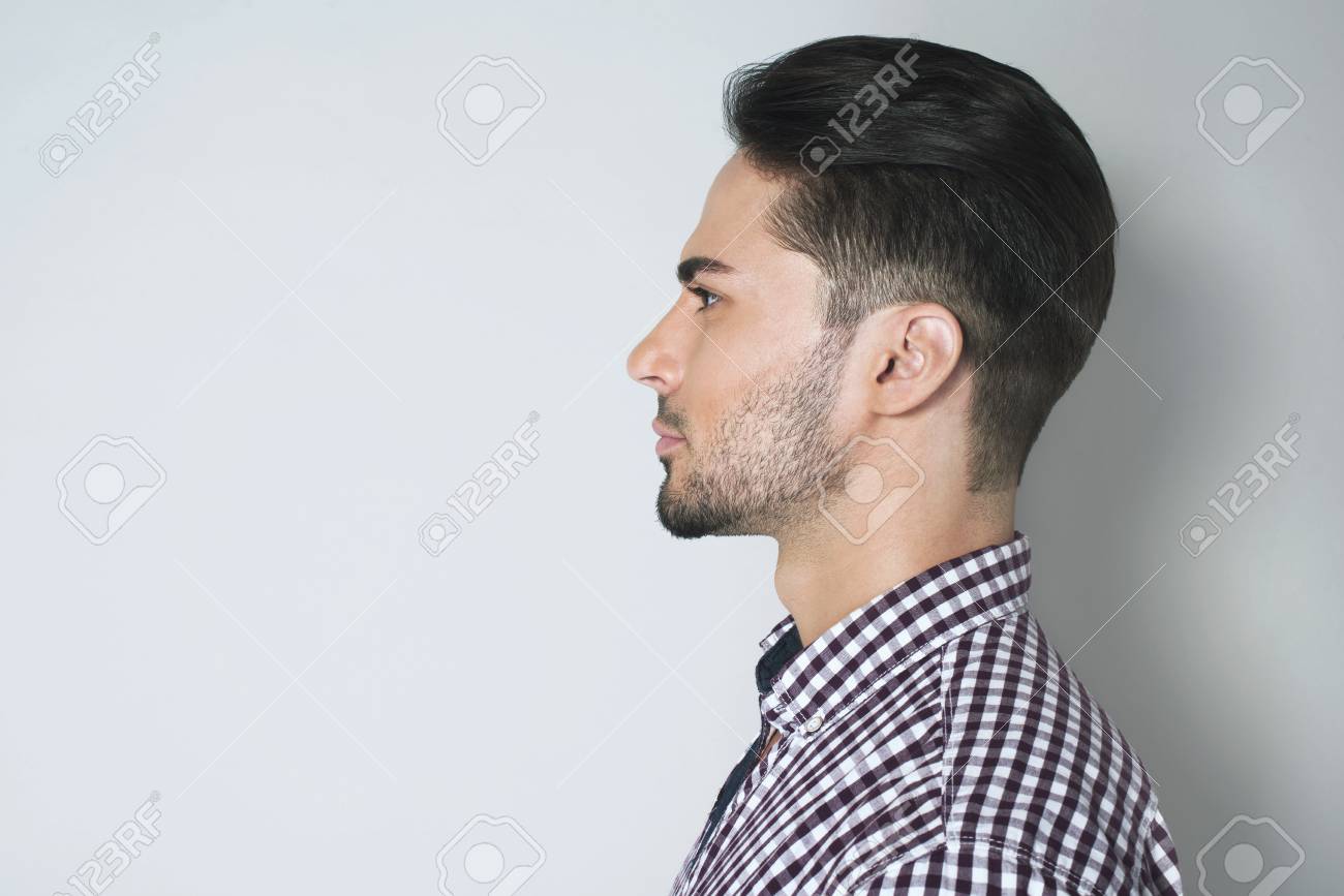 74124701-side-view-of-handsome-young-man-beautiful-profile-of-brunette-man-in-checkered-shirt-against-light-g.jpg