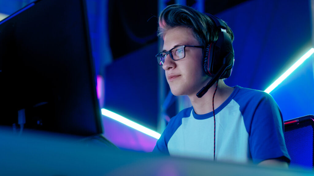 Teenage-Boy-Gamer-Plays-in-Competitive-Video-Game-on-an-egames-competition-1024x576.jpg