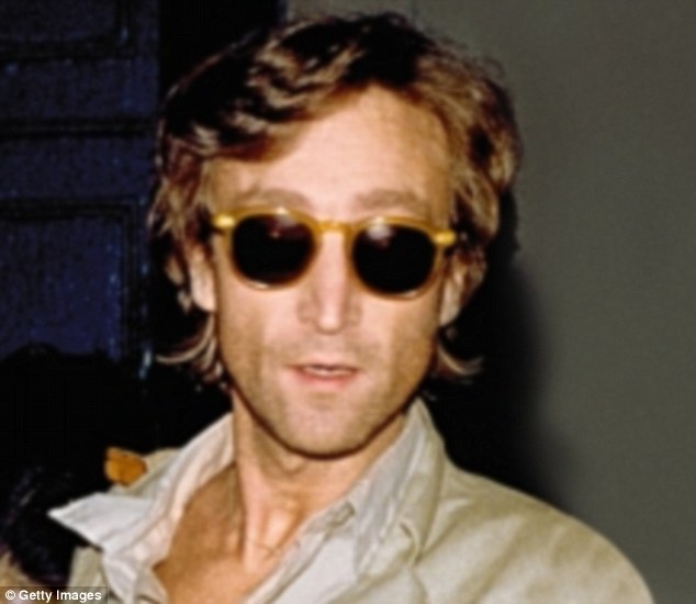 Former Beatle John Lennon signs autographs outside the Times Square recording studio 'The Hit Factory' after a recording session of his final album 'Double Fanasy' in August 1980