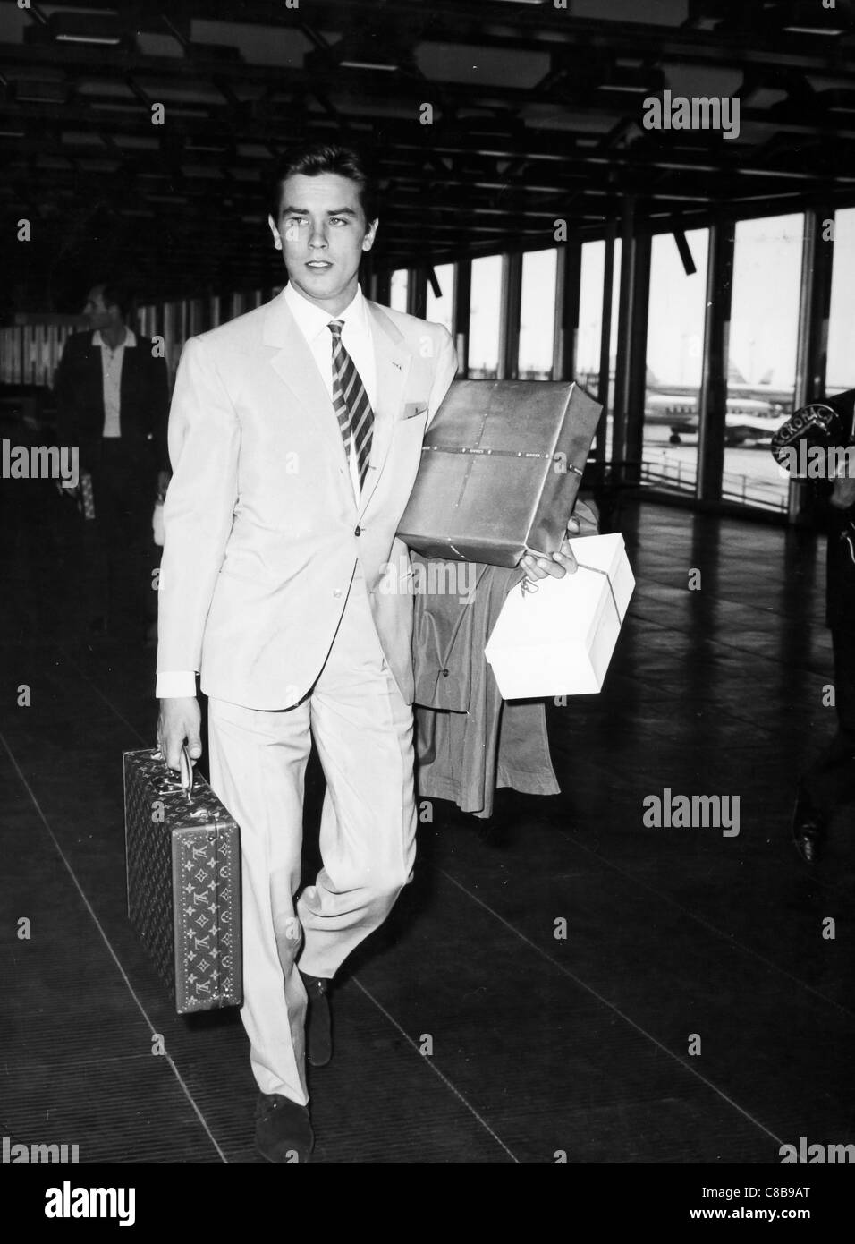alain-delon-at-the-airport-C8B9AT.jpg