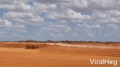 a large explosion in a dirt field with the words viralhog below