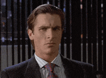 a man in a suit and tie looks serious