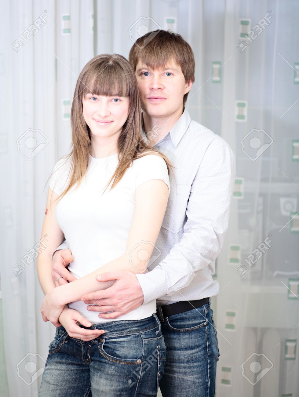 8092736-young-happy-white-couple-in-jeans-embracing.jpg