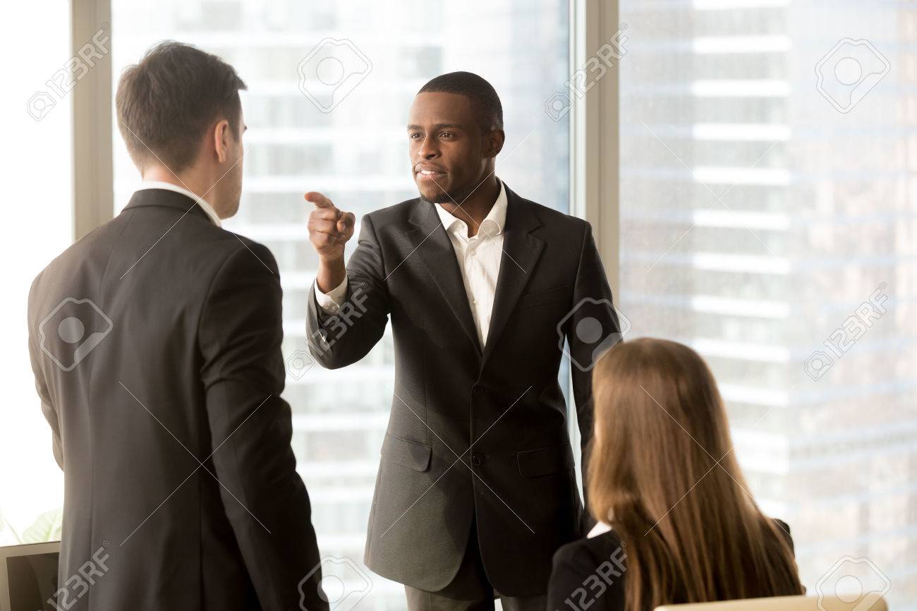 80123722-angry-african-american-businessman-threatens-colleague-conflict-between-male-workers-at-workplace.jpg