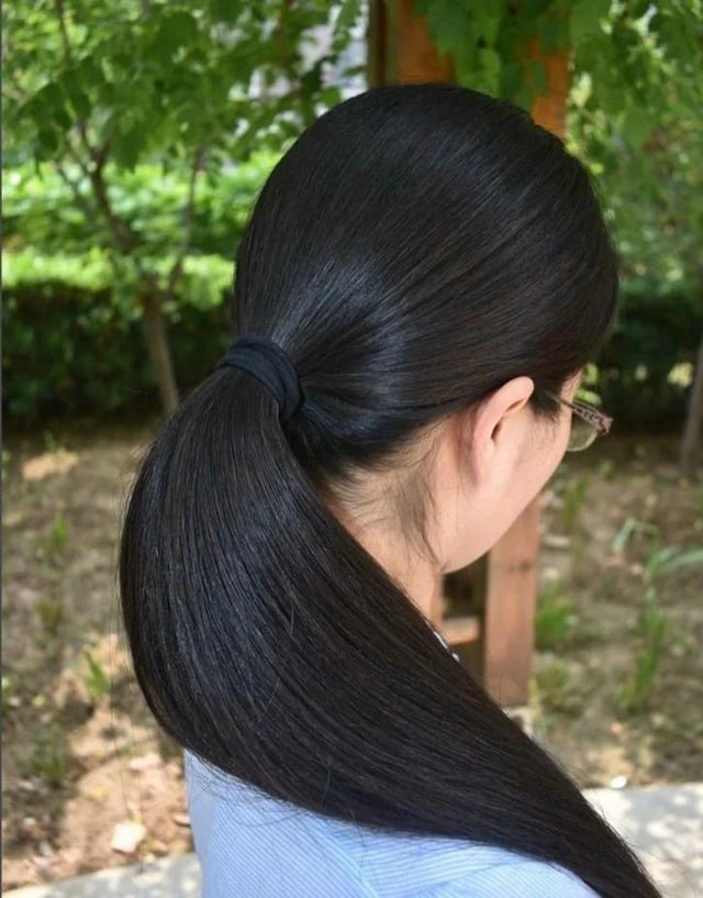 asian-girl-with-thick-shiny-hair-tied-with-a-black-hair-tie-v0-rb8s9j2ddyxa1.jpg