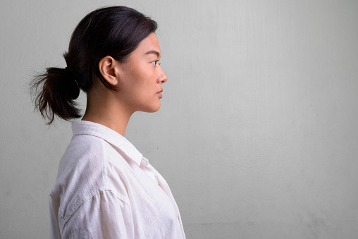 profile-view-of-young-beautiful-asian-woman-with-hair-tied.jpg