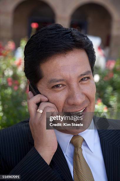 businessman-in-park-cusco-peru-on-mobile-phone.jpg
