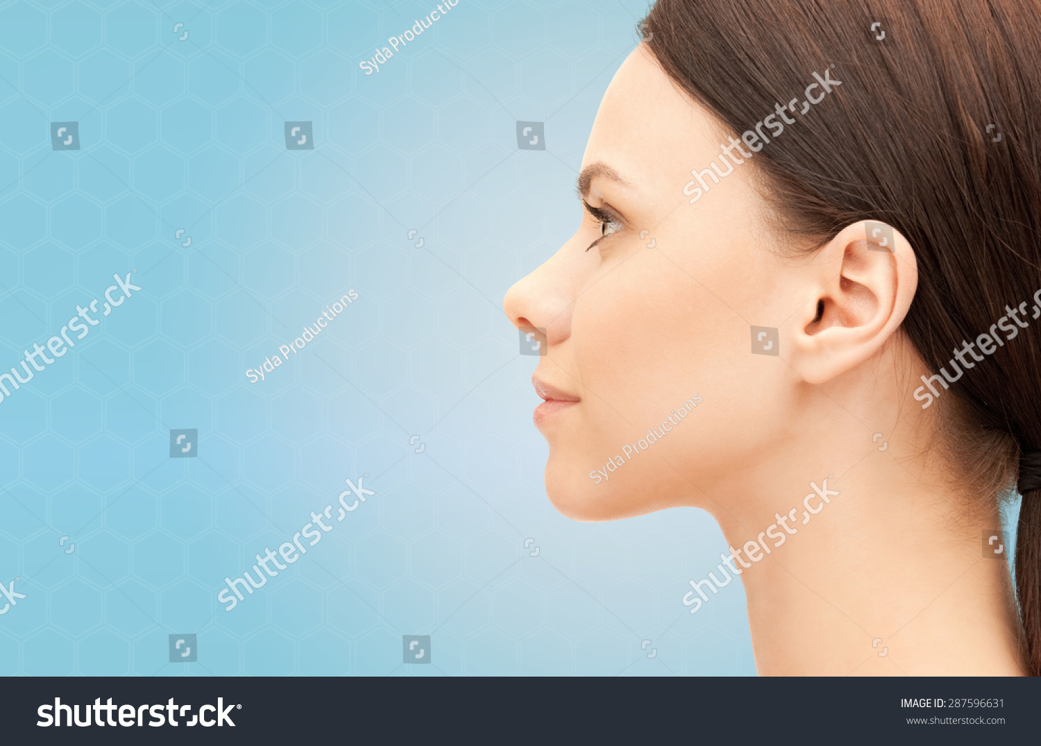 stock-photo-health-people-plastic-surgery-and-beauty-concept-beautiful-young-woman-face-over-blue-background-287596631.jpg