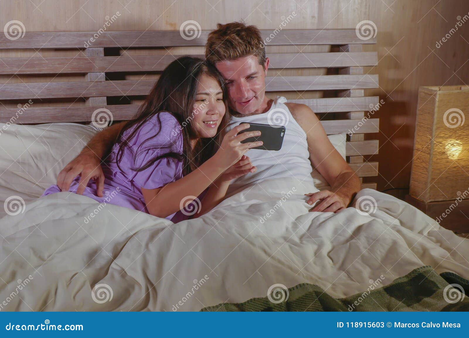 young-attractive-beautiful-mix-ethnicity-happy-couple-asian-korean-woman-caucasian-man-lying-bed-cuddling-sweet-us-118915603.jpg