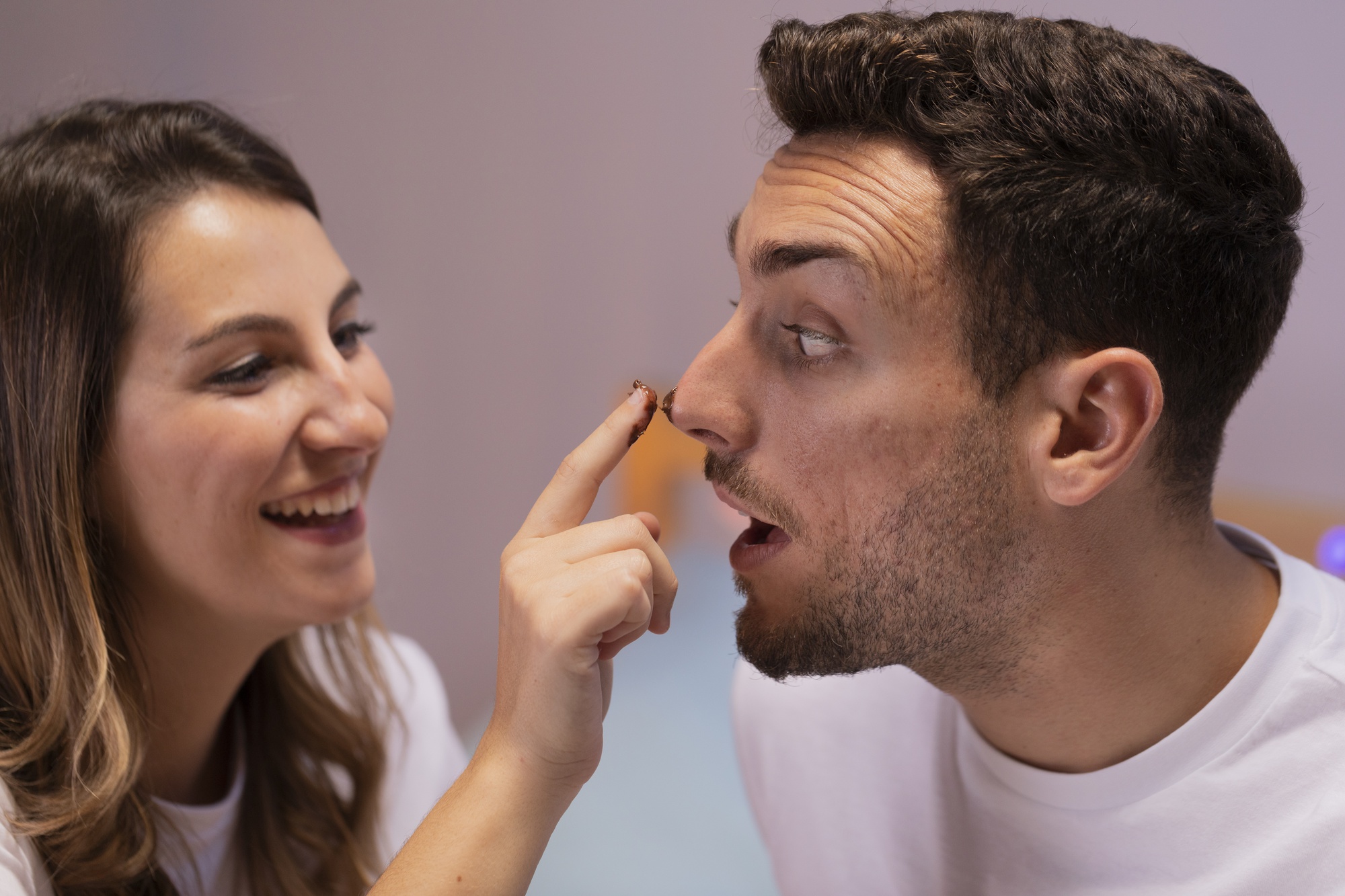 love-couple-playing-with-chocolate_23-2148378980.jpg
