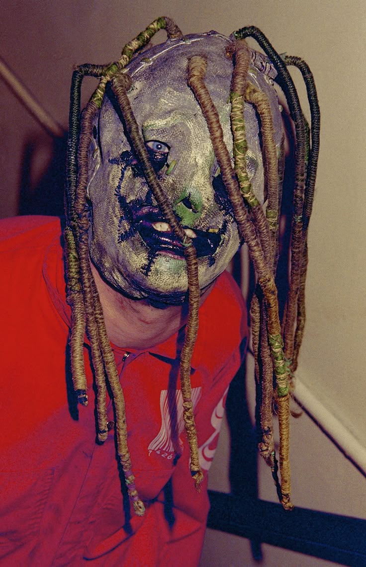 This may contain: a man with dreadlocks on his head and face