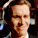 a close up of a man with his eyes closed smiling