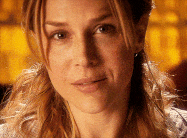 a close up of a woman 's face with her eyes closed