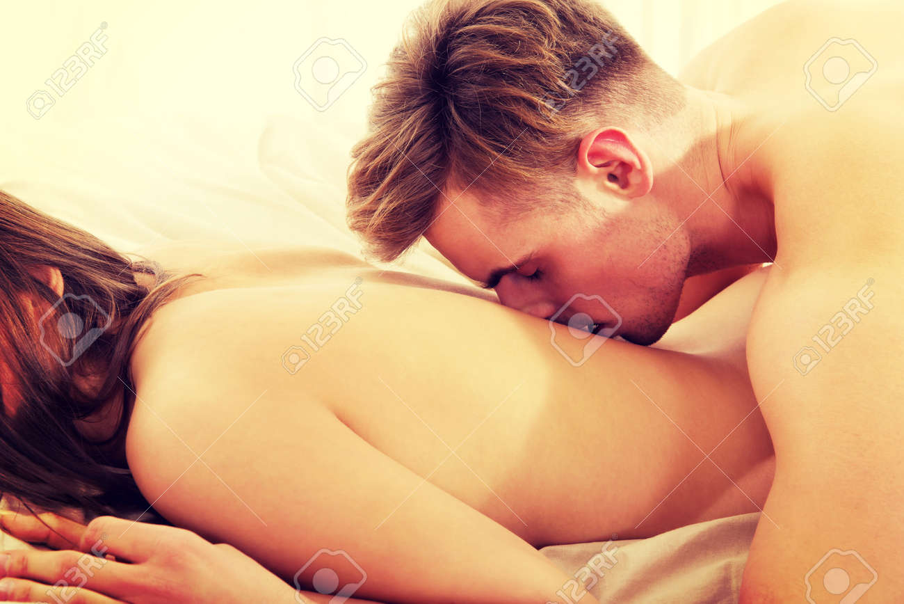 Man Kissing Woman In Her Back On Bed. Stock Photo, Picture And Royalty Free  Image. Image 41149249.