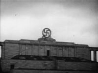 Swastika_blasted_from_the_Nazi_party_rally_grounds_-_Nuremberg_1945.gif