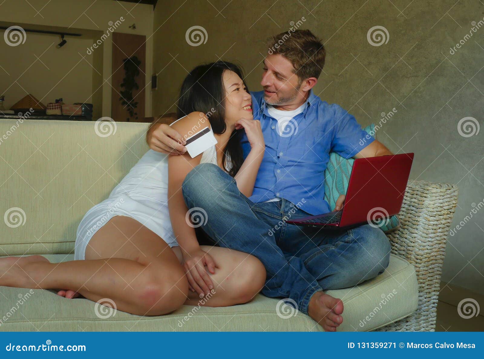 young-happy-excited-mixed-ethnicity-couple-asian-chinese-woman-white-man-internet-banking-online-shopping-cr-credit-card-131359271.jpg