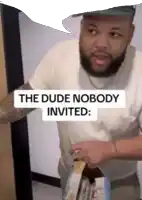 a man with a beard is holding a bag of food and says  the dude nobody invited 