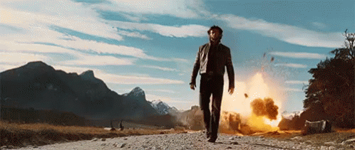 Guy Walking Away From Explosion Gif
