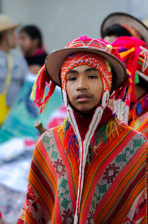 144541757-caraz-peru-july-19-2010-portrait-of-young-boy-dressed-in-the-typical-incan-andean-orange-suit.jpg
