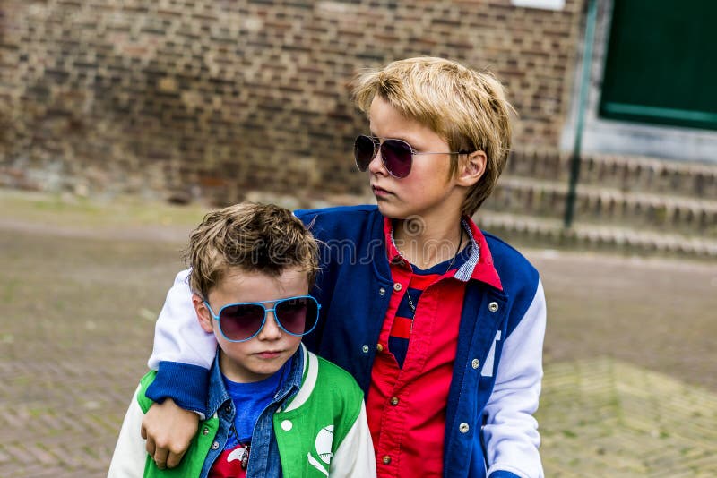 bad-boys-two-cool-kids-sunglasses-looking-tough-31259117.jpg