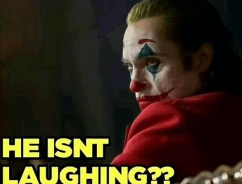 This may contain: a man with his face painted like a clown and text that reads, the isn't laughing?