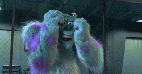 sulley from monsters inc is making a face with his hands