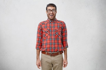 shocked-young-male-nerd-wears-old-fashionable-glasses-checkered-shirt-trousers_273609-8295.jpg
