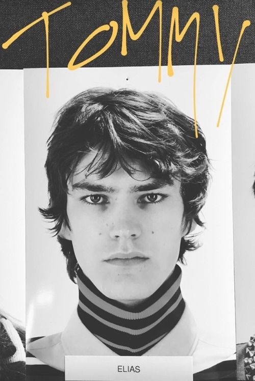This may contain: two young men with neck ties on the cover of tommy's album, ellas