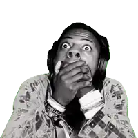 a man wearing headphones covering his mouth with his hands