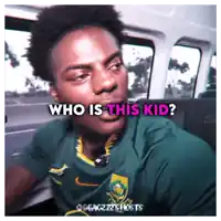 a man wearing a green shirt with the words who is this kid below him