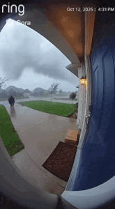 a ring doorbell shows a person walking down the sidewalk
