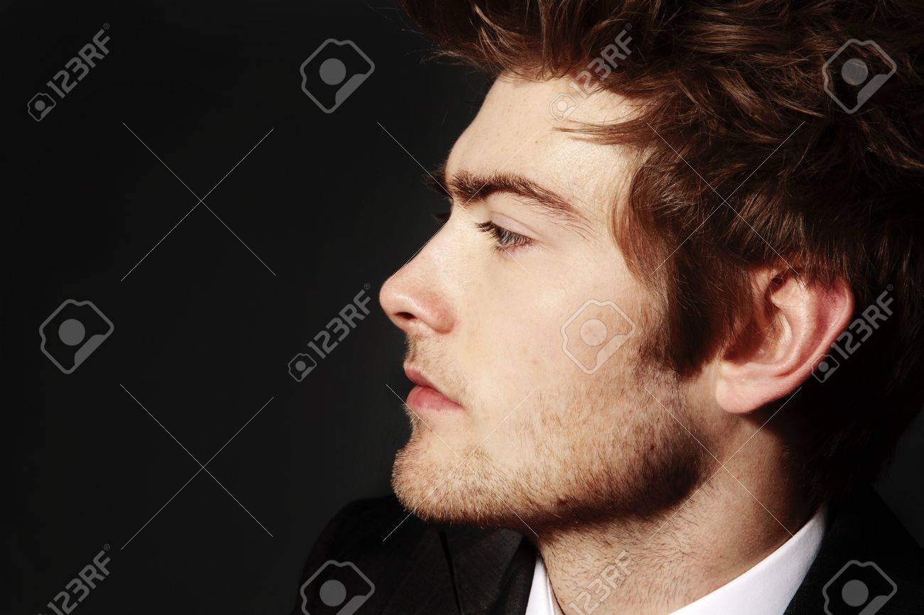 12503354-low-key-image-of-side-profile-of-a-young-man.jpg