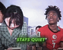 a man wearing a red nike shirt with the number 7 on it