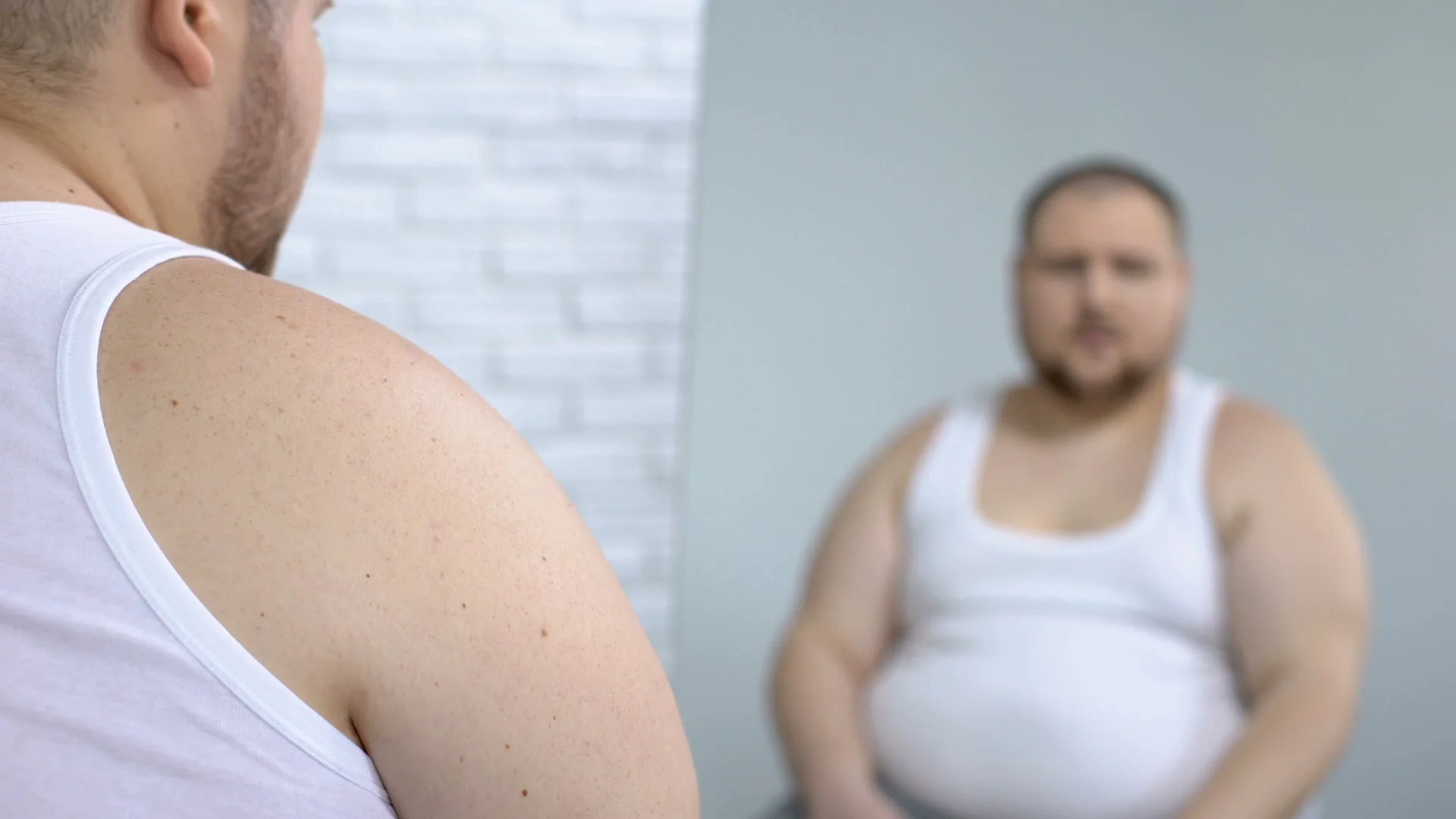 depressed-fat-male-looking-his-footage-089443437_prevstill.jpeg