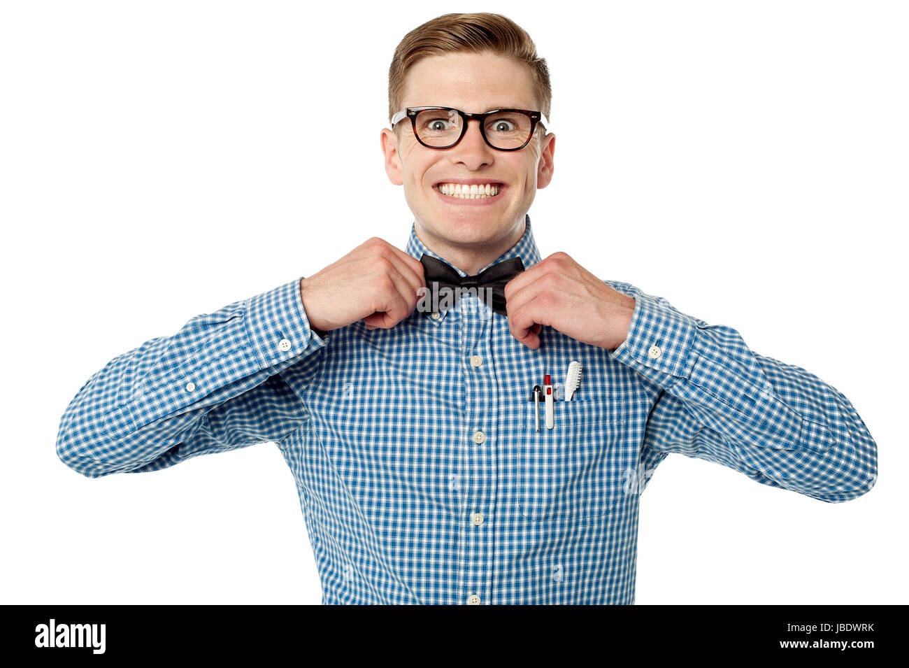 Smiling young geek guy adjusting his bow tie Stock Photo - Alamy