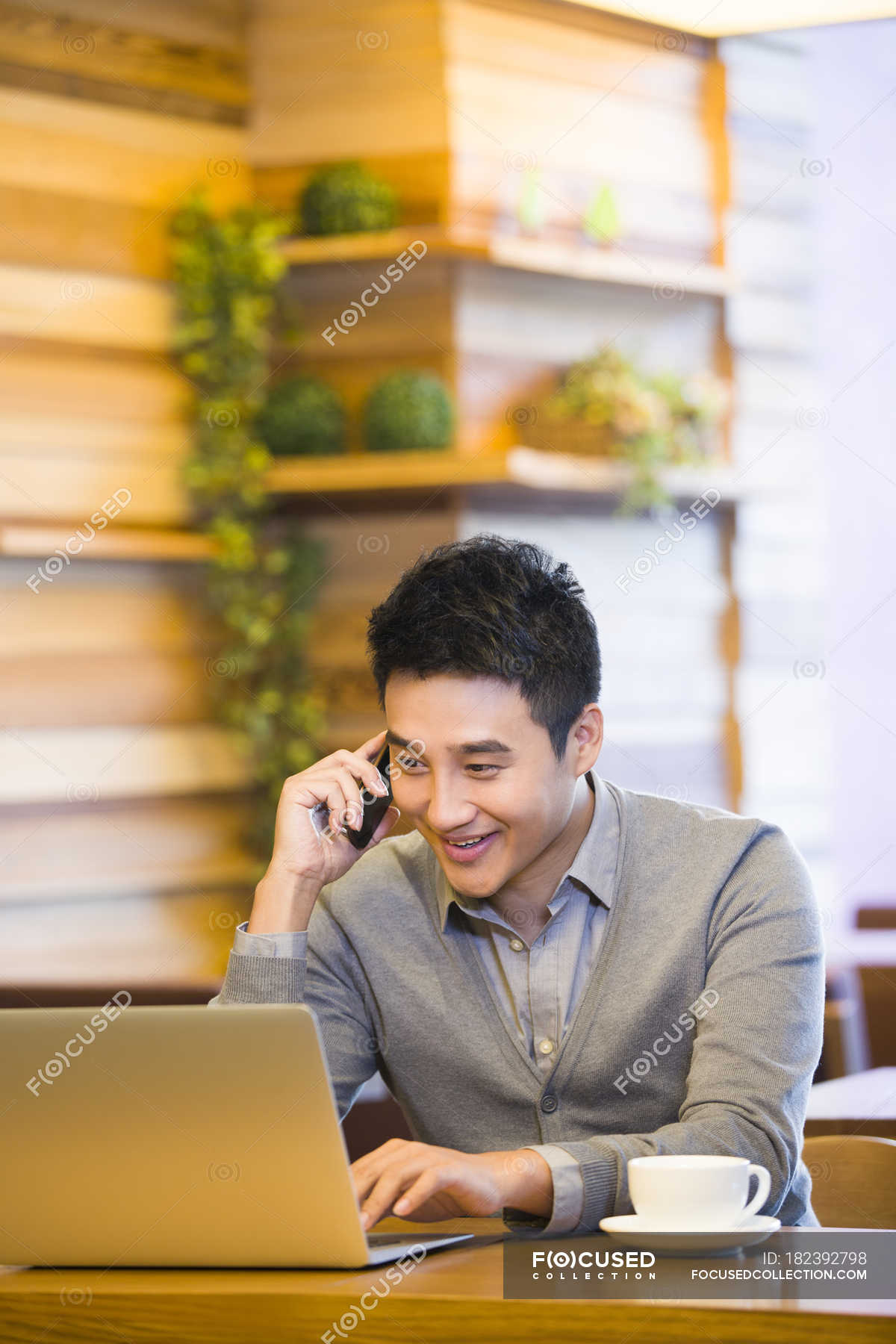 focused_182392798-stock-photo-chinese-man-talking-phone-using.jpg