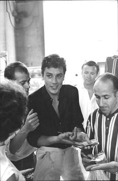 This contains an image of: Alain Delon