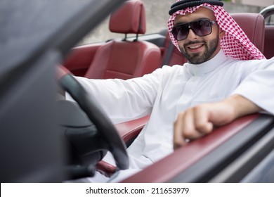 arabic-young-businessman-driving-car-260nw-211653979.jpg