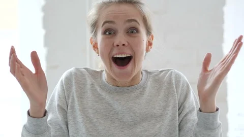 young-woman-amazed-surprised-wondering-footage-091518645_iconl.jpeg