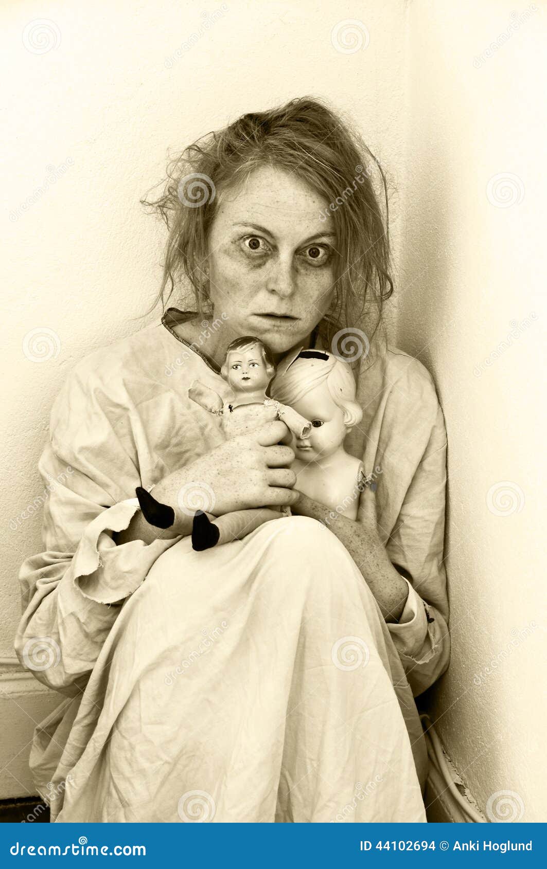 mentally-ill-woman-psychiatric-ward-two-dolls-44102694.jpg