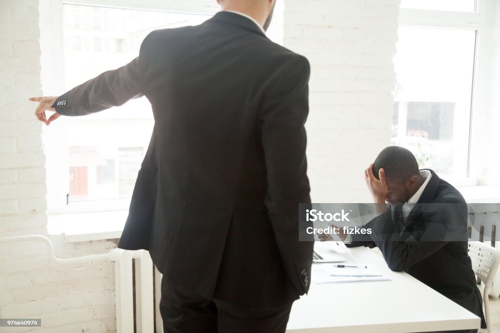 angry-employer-asking-fired-african-american-worker-to-leave.jpg